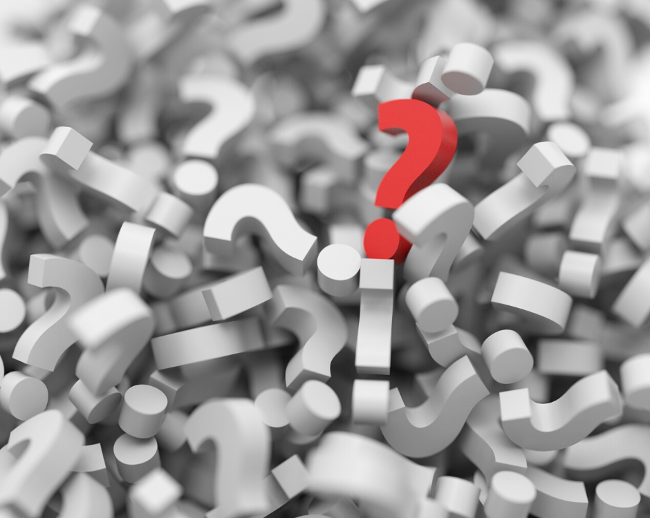 Red question mark in pile of question marks