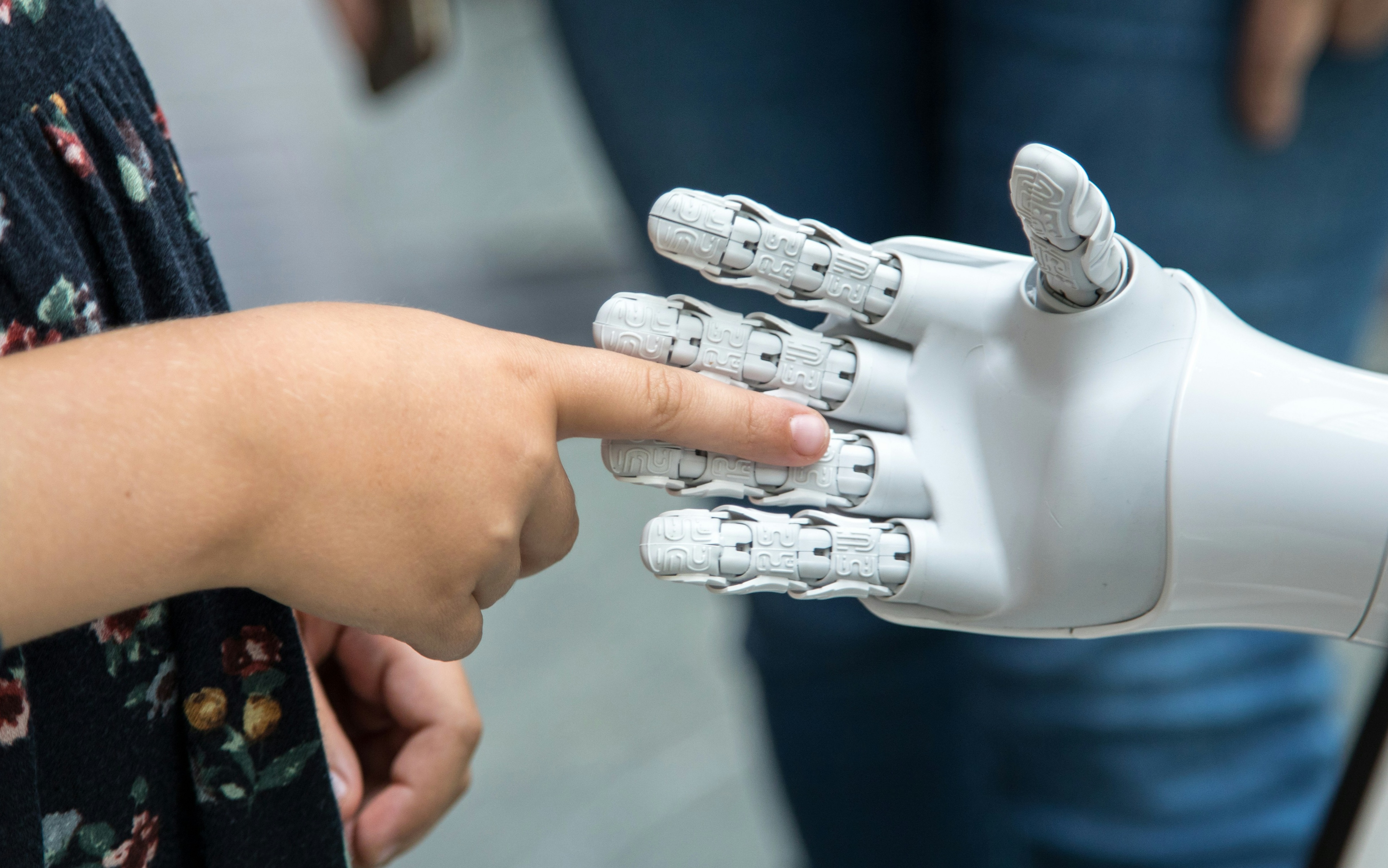 Robot touching human hand